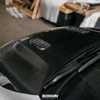Seibon 2023+ Toyota GR Corolla OE-Style Carbon Fiber Hood - Gloss Finish (HD23TYGRCOR-OE)