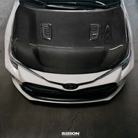 Seibon 2023+ Toyota GR Corolla OE-Style Carbon Fiber Hood - Gloss Finish (HD23TYGRCOR-OE)